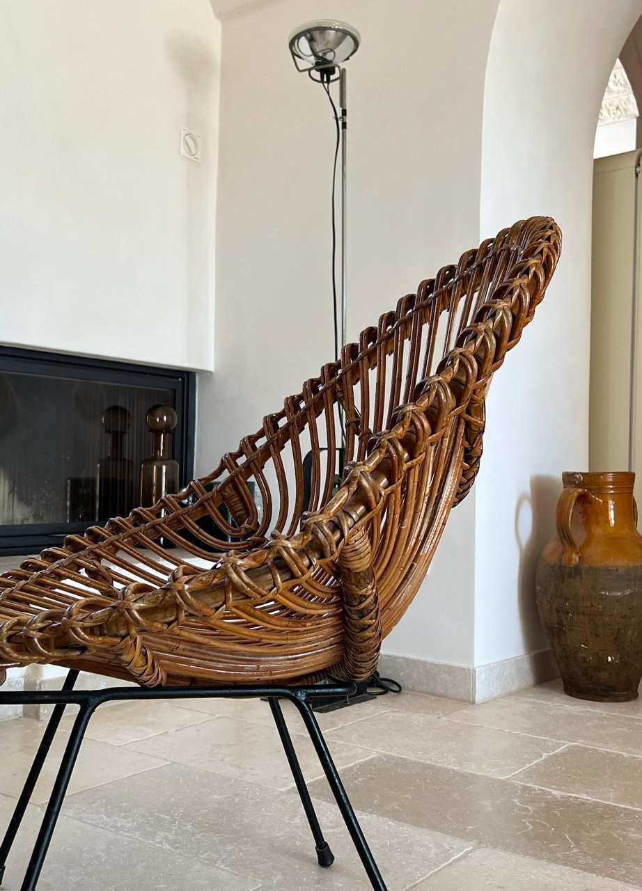 Rattan armchair with steel frame in an Apulian interior