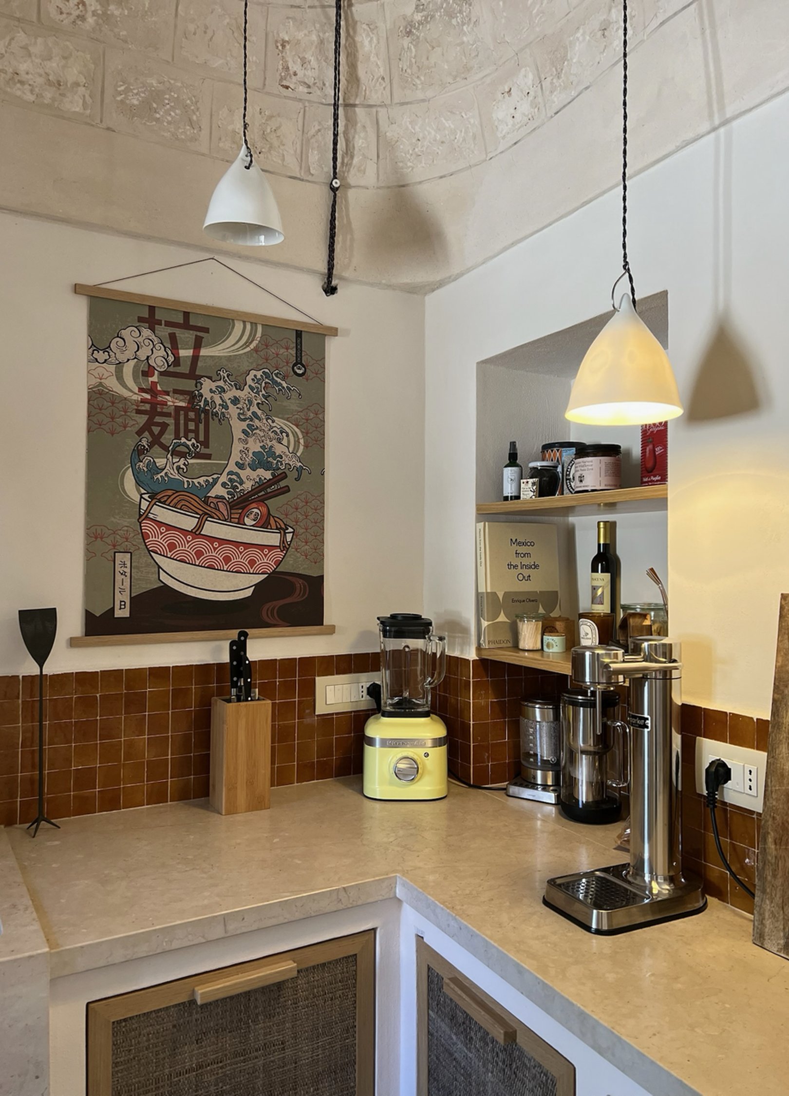 Kitchen with stone vault, ramen poster and yellow mixer